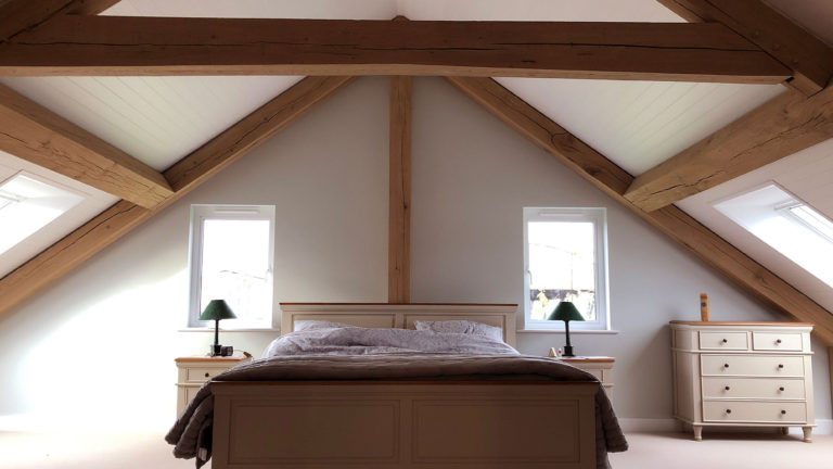 Bedroom interior of bespoke oak timber frame building